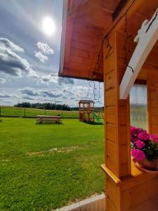 a view of a park with a bench and a playground at Dolina Skawy in Skawa