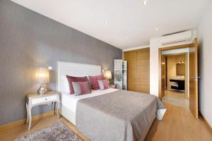 a bedroom with a large bed and a bathroom at Tourismer C in Lagos +21 photos