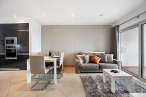a living room with a table and a couch at Tourismer C in Lagos