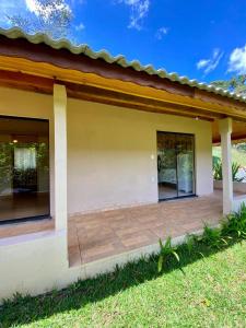 a small house with a patio at Casa Araucária in Cunha