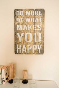 a painting hanging on a wall above a table at Bauernhof Marquardt in Fehmarn +47 photos