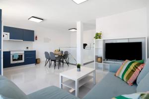 a living room with a couch and a table at Brisa 3 in La Santa