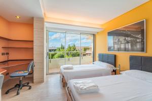 a hospital room with two beds and a window at Villa Agusmar in Llucmajor +18 photos