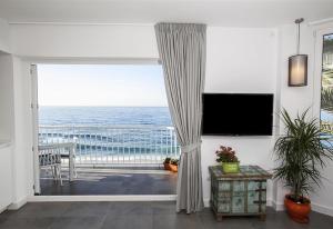 a living room with a view of the ocean at Super Front Line Modern New Apartm in Nerja