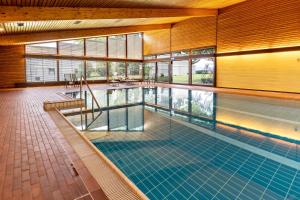 an indoor swimming pool in a building at Ferienwohnung Fetscher 2 in Reichenau