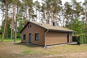 a small house in the middle of a forest at Müritzblick in Vipperow
