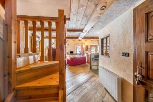 a wooden hallway with a staircase in a house at Arpy an in Morgex