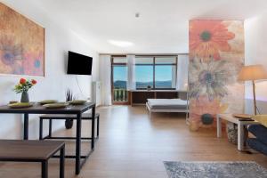 a living room with a couch and a table at Fewo S22 in Regen