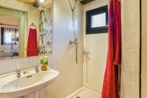 a bathroom with a sink and a mirror at Castell del Montgrí Rural in Torroella de Montgrí +18 photos