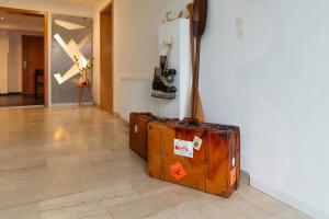 two suitcases sitting on the floor in a room at Ferienwohnung Morgentau in Germersheim