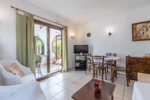 a living room with a couch and a table at Villa Margarita in Benissa