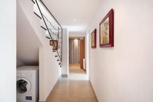 a hallway with a washer and dryer in a house at Villa Nespolo in Levanto