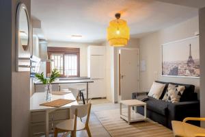 a living room with a couch and a table at Apartment Dolmen de Viera in Antequera