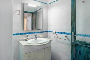 a bathroom with a sink and a mirror at Las Sales Duplex in Moya +19 photos