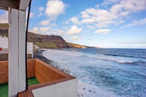 a view of the ocean from a balcony at Las Sales Duplex in Moya