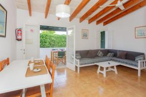 a living room with a couch and a table at Son Xoriguer 6 in Son Xoriguer