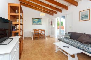 a living room with a couch and a table at Son Xoriguer 6 in Son Xoriguer