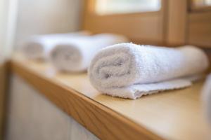 a couple of towels are sitting on a counter at Manuel's App Watschinger -Edelweiss in Sesto +16 photos