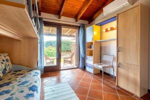 a small room with a bed and a balcony at Villa Sofia in Cuile Pazzoni +23 photos