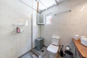 a bathroom with a toilet and a sink at Casa Di Babis in Gaios +14 photos