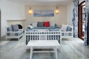 a living room with a couch and two chairs at Dalias Nerja in Nerja