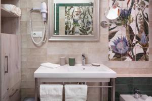 a bathroom with a sink and a mirror at Dalias Nerja in Nerja +28 photos