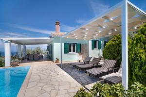 a house with a swimming pool and a pergola at Villa Belvedere Verde in Lefkada