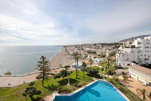 an aerial view of a city and the ocean at Primera linea vistas panoramicas in Torremolinos