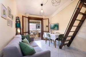 a living room with a couch and a table at Chelubirdi in Villasimius