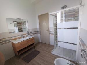 a bathroom with a sink and a toilet and a mirror at Adamo Flat in Bisciano +79 photos