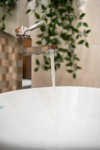 a sink with water coming out of a faucet at Chelubirdi in Villasimius