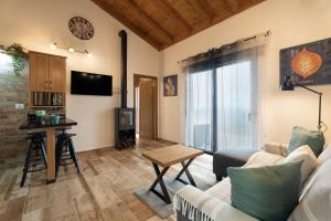 a living room with a couch and a table at Los Almendr2s in Frontera