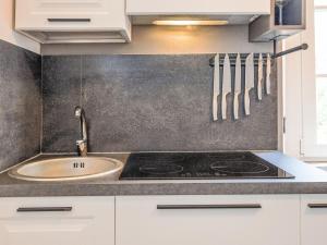 a kitchen with a sink and a stove at Apartment The Knight's Rest by Interhome in Bibbona +32 photos