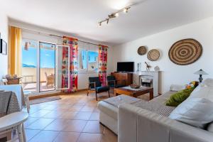a living room with a couch and a table at Las Terrazas in La Cala de Mijas