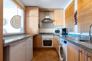 a kitchen with a sink and a dishwasher at Las Terrazas in La Cala de Mijas