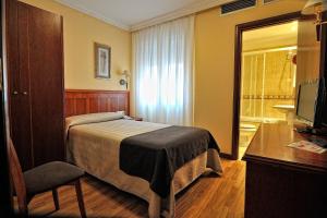 Postel nebo postele na pokoji v ubytování Hotel Alisi