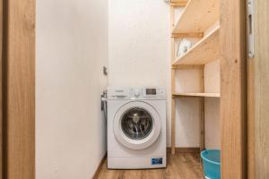 a washer and dryer in a small room at Condominio Lucia 7 Pinzolo in Pinzolo
