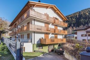a building with balconies on the side of it at Condominio Lucia 7 Pinzolo in Pinzolo
