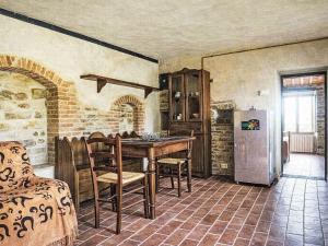 a kitchen with a table and a refrigerator at Apartment Cotoneaster by Interhome in Perugia
