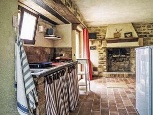 a kitchen with a stove and a counter top at Apartment Cotoneaster by Interhome in Perugia +9 photos