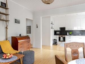a living room with a couch and a table at Apartment Alegränd by Interhome in Falkenberg