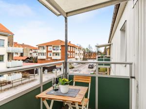 a balcony with a table and a view of a street at Apartment Alegränd by Interhome in Falkenberg