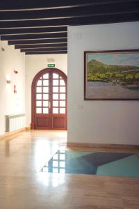 a room with a door and a painting on the wall at Hostal Boutique Canyamel in Canyamel