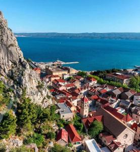 an aerial view of a town next to the water at Kuća Ružica in Omiš