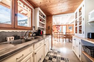 a kitchen with a sink and a counter at Chalet Phidel - 11 personnes in Bernex