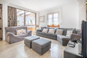 a living room with a couch and a table at Ca Na Kika in Alcudia