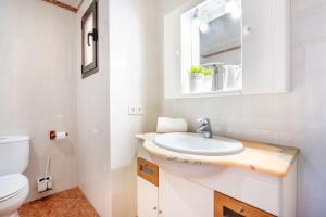 a bathroom with a sink and a toilet at Ca Na Kika in Alcudia