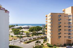 a view of the beach from a building at T2 com piscina centro Vilamoura in Vilamoura