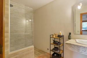 a bathroom with a shower and a sink at Can Mussenya 1 in Illes Balears