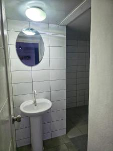 a bathroom with a sink and a mirror at beautiful vacation Sol Caribe in Punta Cana +9 photos
